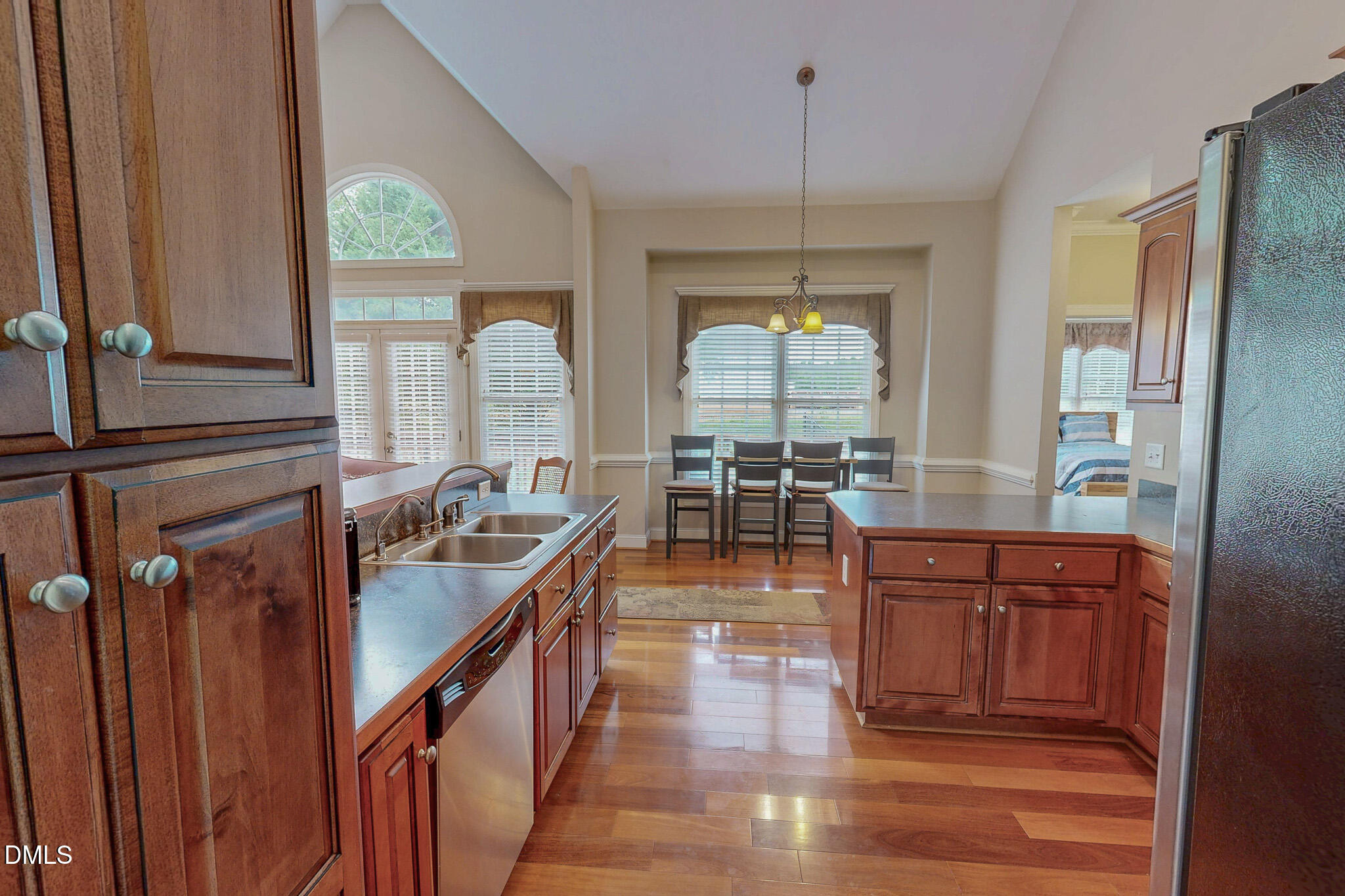 115 Duncan Plantation Road Timberlake, NC 27583 - Photo 33 of 48 a view of a kitchen with kitchen island granite countertop a large window and a view of living room