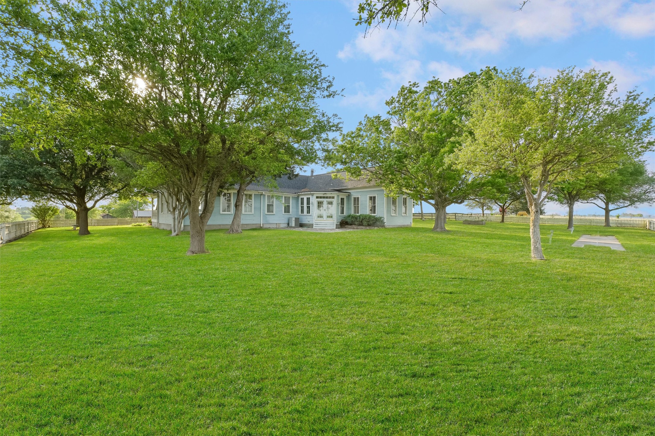 9058 Sam Houston Road Brenham, TX 77833 - Photo 22 of 50 a view of house with a big yard
