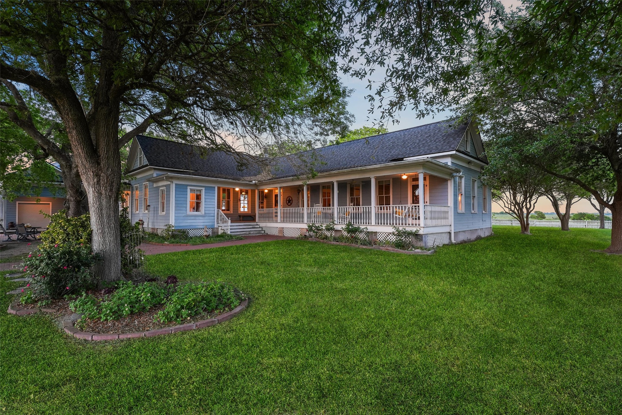 9058 Sam Houston Road Brenham, TX 77833 - Photo 29 of 50 a view of a house with a yard deck and a large tree