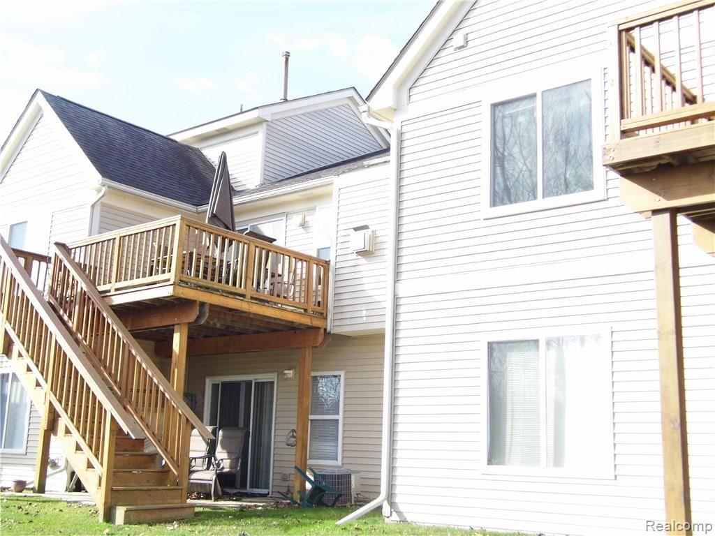 457 Lilly View Court Howell, MI 48843 - Photo 6 of 33 Elevated deck and patio for entertaining