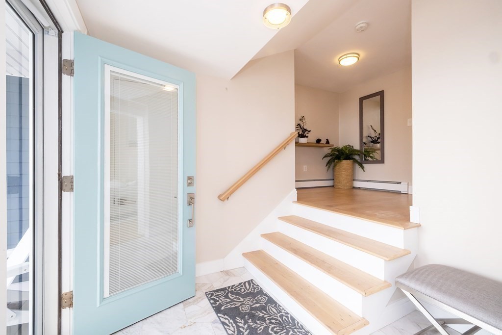 113 Glades Road Scituate, MA 02066 - Photo 12 of 41 a view of entryway and hall with wooden floor