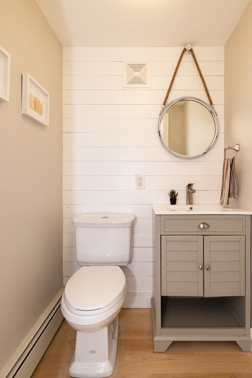 113 Glades Road Scituate, MA 02066 - Photo 13 of 41 a bathroom with a toilet a sink and mirror