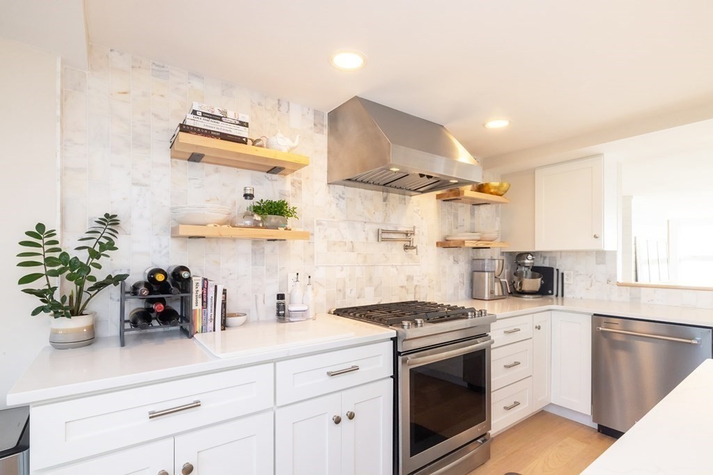 113 Glades Road Scituate, MA 02066 - Photo 17 of 41 a kitchen with stainless steel appliances white cabinets and a sink