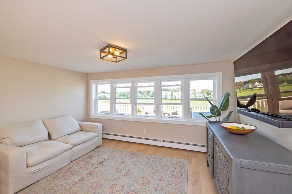 113 Glades Road Scituate, MA 02066 - Photo 18 of 41 a living room with furniture and a window