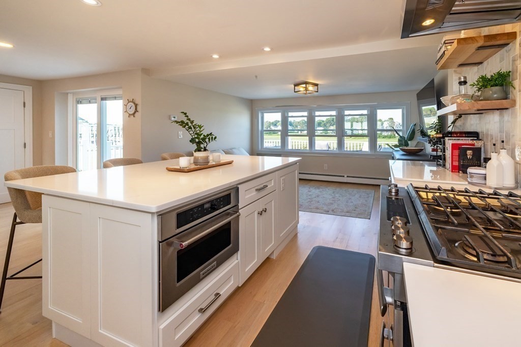 113 Glades Road Scituate, MA 02066 - Photo 20 of 41 a kitchen with a stove and a wooden floors