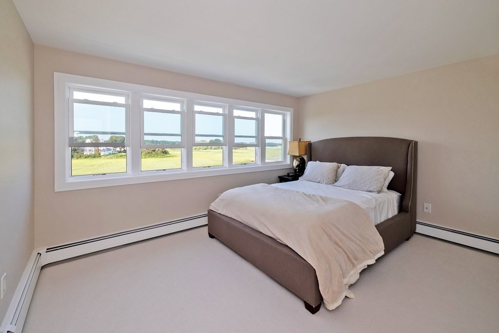 113 Glades Road Scituate, MA 02066 - Photo 25 of 41 a bedroom with a bed and window