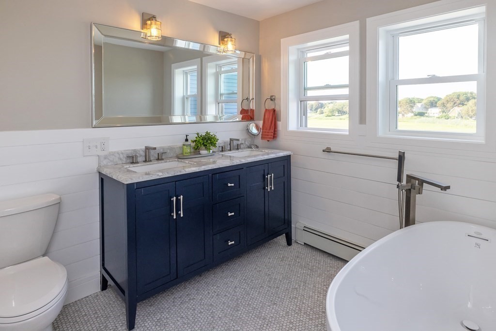 113 Glades Road Scituate, MA 02066 - Photo 27 of 41 a bathroom with a toilet sink and mirror