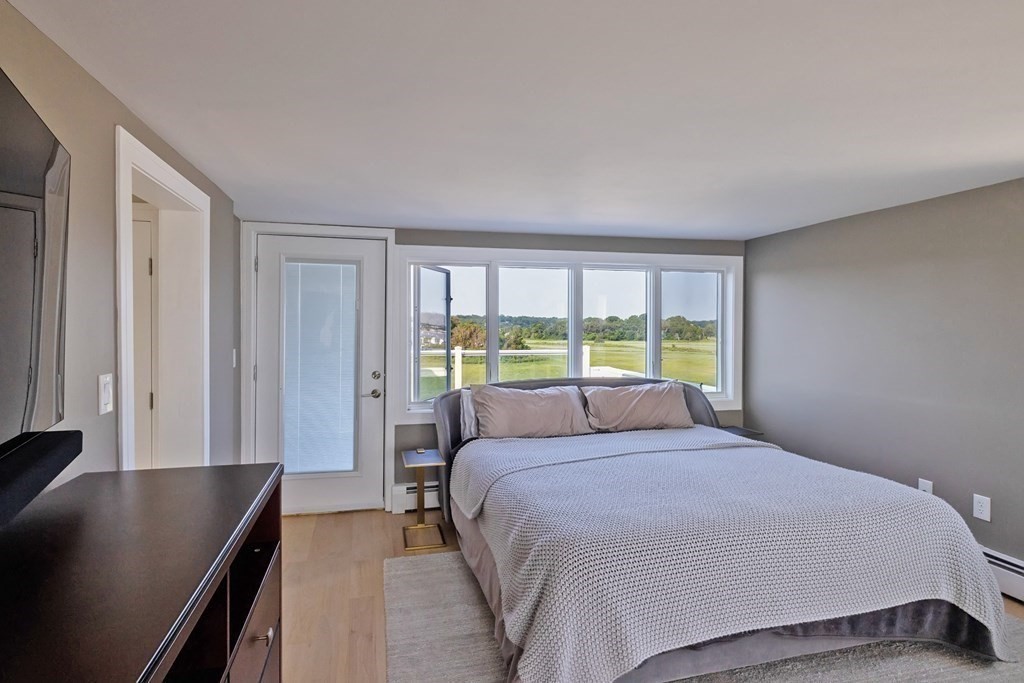 113 Glades Road Scituate, MA 02066 - Photo 29 of 41 a bedroom with a large bed and a window