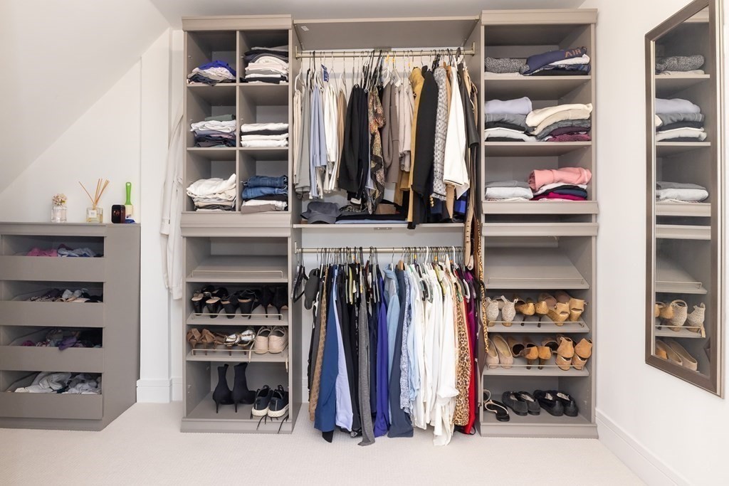 113 Glades Road Scituate, MA 02066 - Photo 30 of 41 a view of walk in closet with clothes and shoes