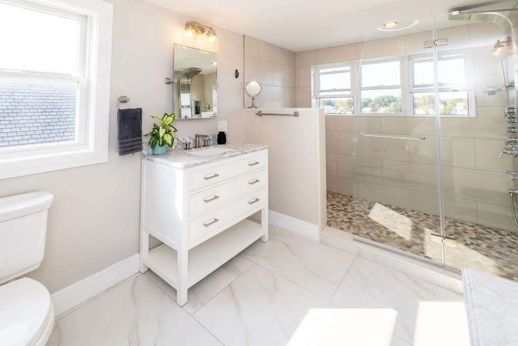 113 Glades Road Scituate, MA 02066 - Photo 36 of 41 a bathroom with a double vanity sink toilet and shower