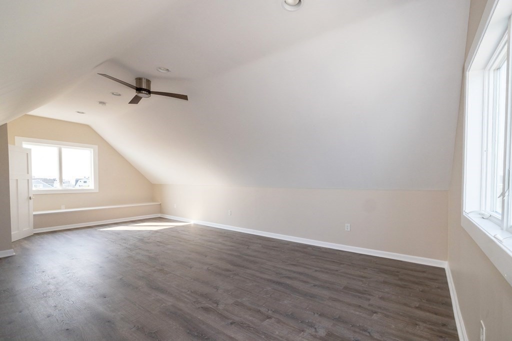 113 Glades Road Scituate, MA 02066 - Photo 38 of 41 an empty room with wooden floor and windows