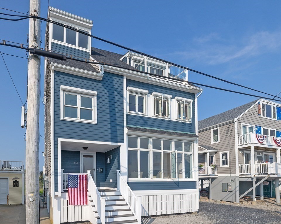 113 Glades Road Scituate, MA 02066 - Photo 4 of 41 a front view of a building with large windows