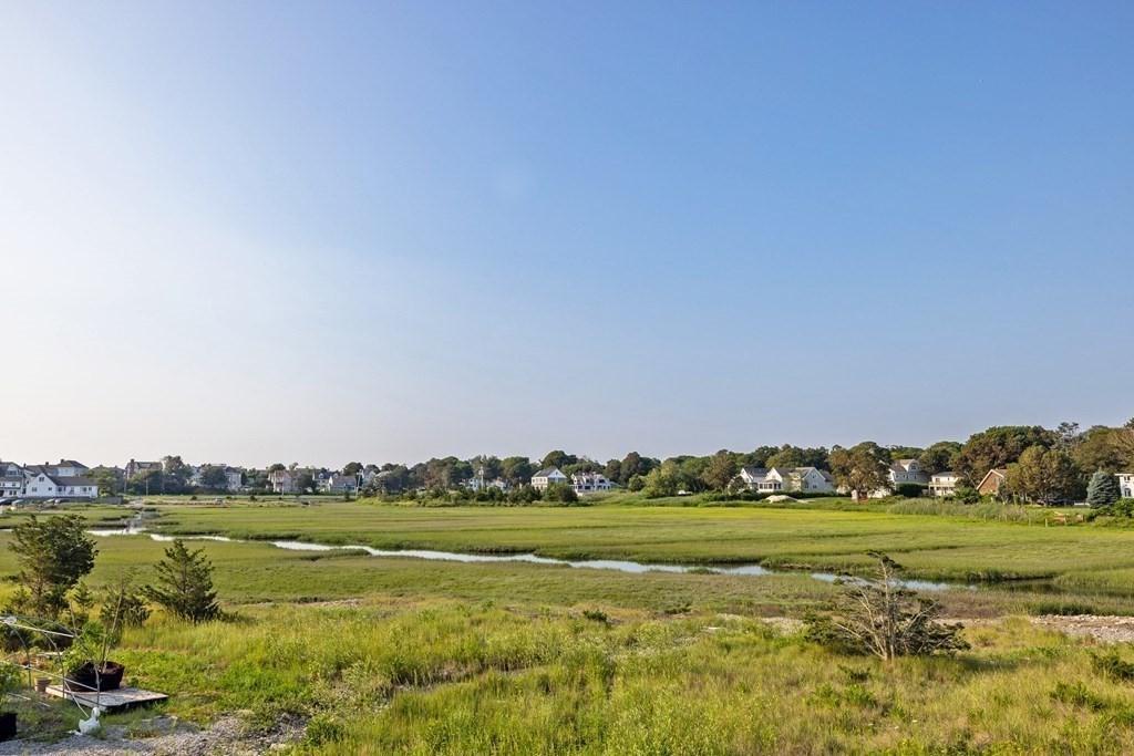 113 Glades Road Scituate, MA 02066 - Photo 6 of 41 a view of a field with an ocean