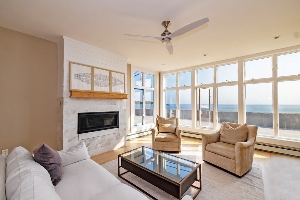 113 Glades Road Scituate, MA 02066 - Photo 10 of 41 a living room with furniture and a fireplace