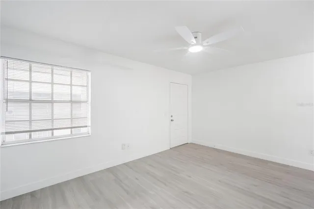 a close view of a sink a faucet and cabinets in the view
