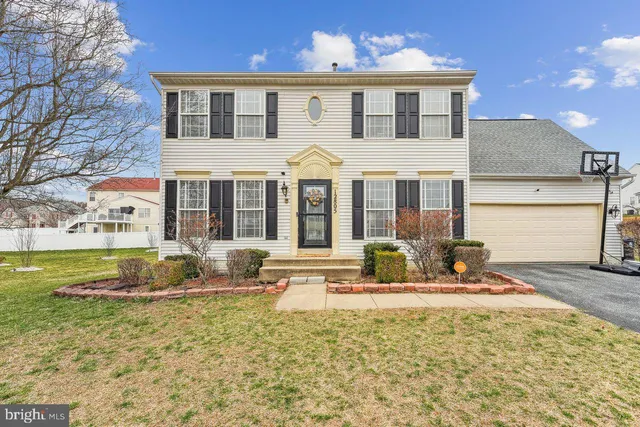 a front view of a house with swimming pool and glass windows