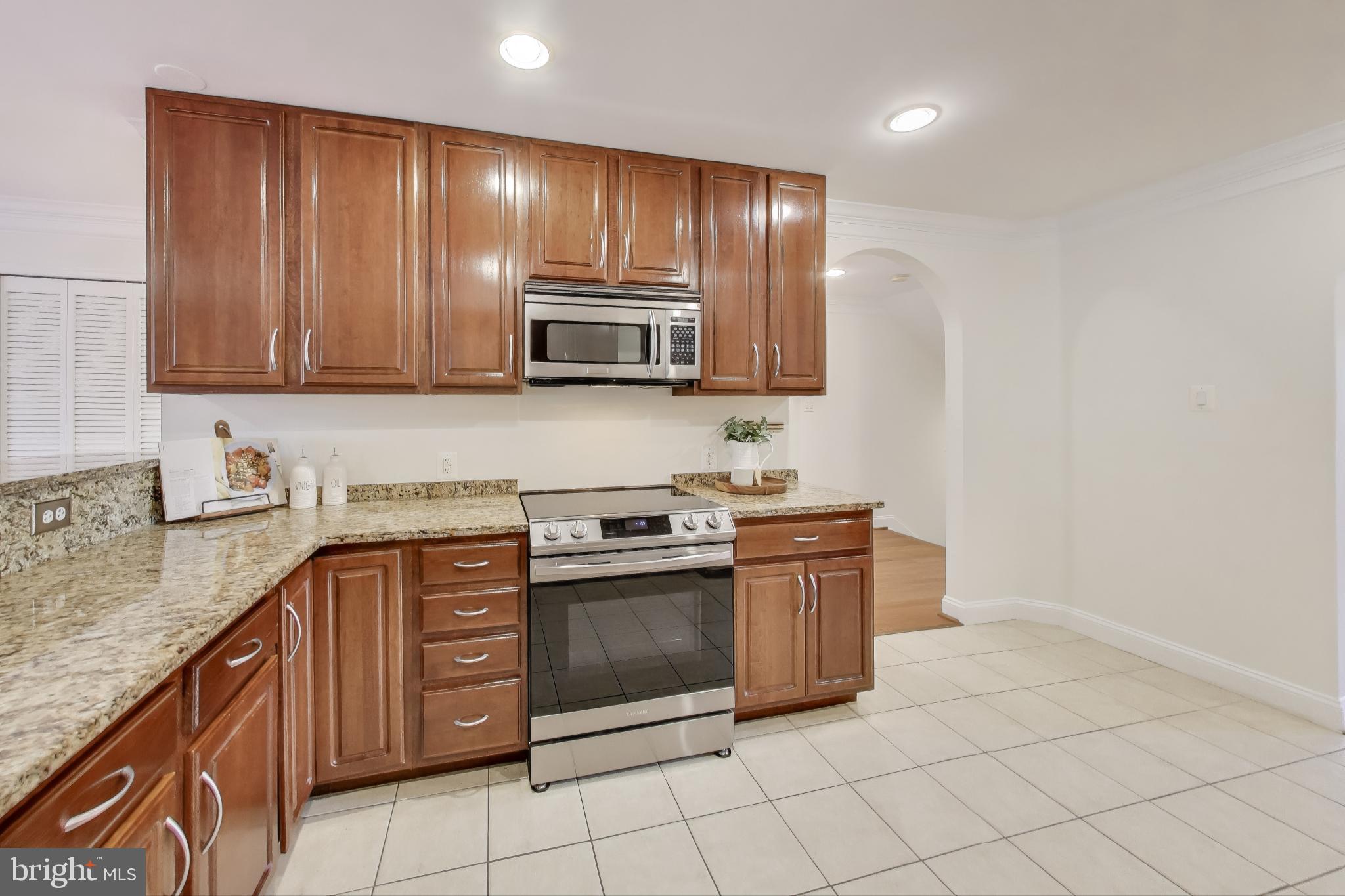 429 Shepherd Street Northwest, Unit 1 Washington, DC 20011 - Photo 11 of 41 Kitchen with Tile Flooring & Stainless Steel Apps