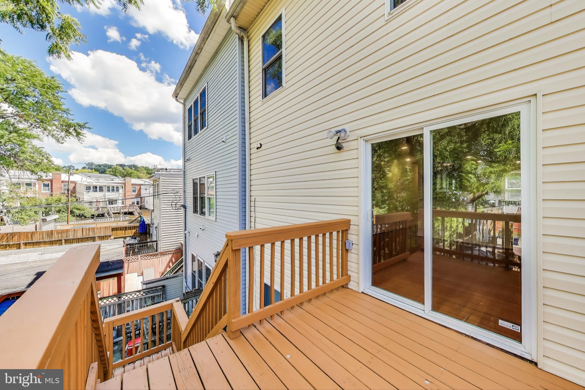 429 Shepherd Street Northwest, Unit 1 Washington, DC 20011 - Photo 32 of 41 Rear Deck with Stairs to Backyard Area
