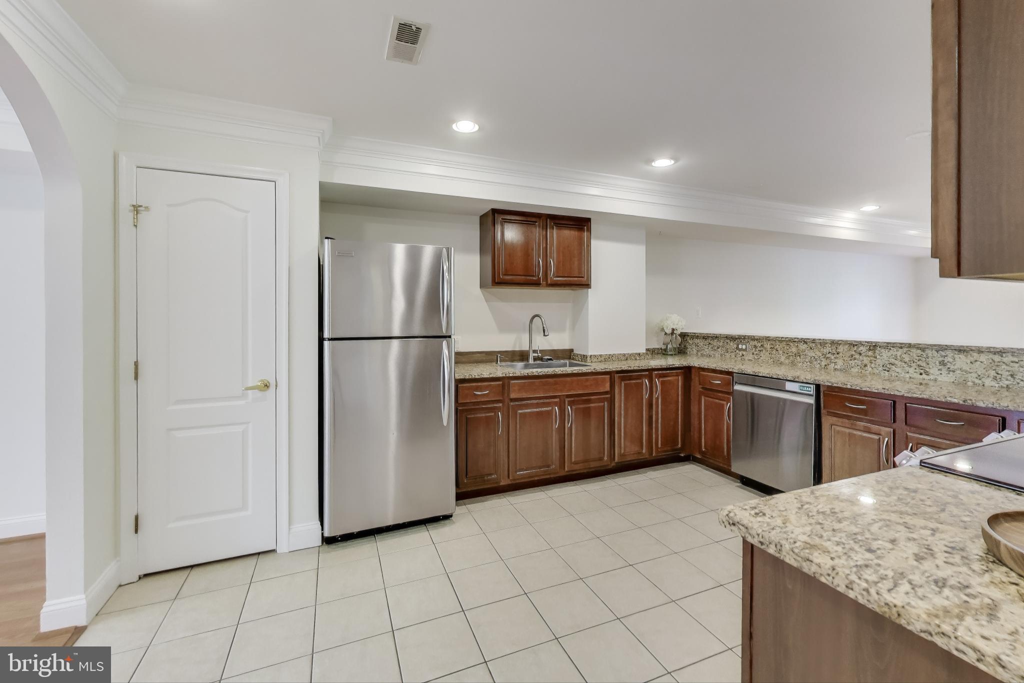 429 Shepherd Street Northwest, Unit 1 Washington, DC 20011 - Photo 10 of 41 Kitchen with a Pantry and Ample Cabinetry