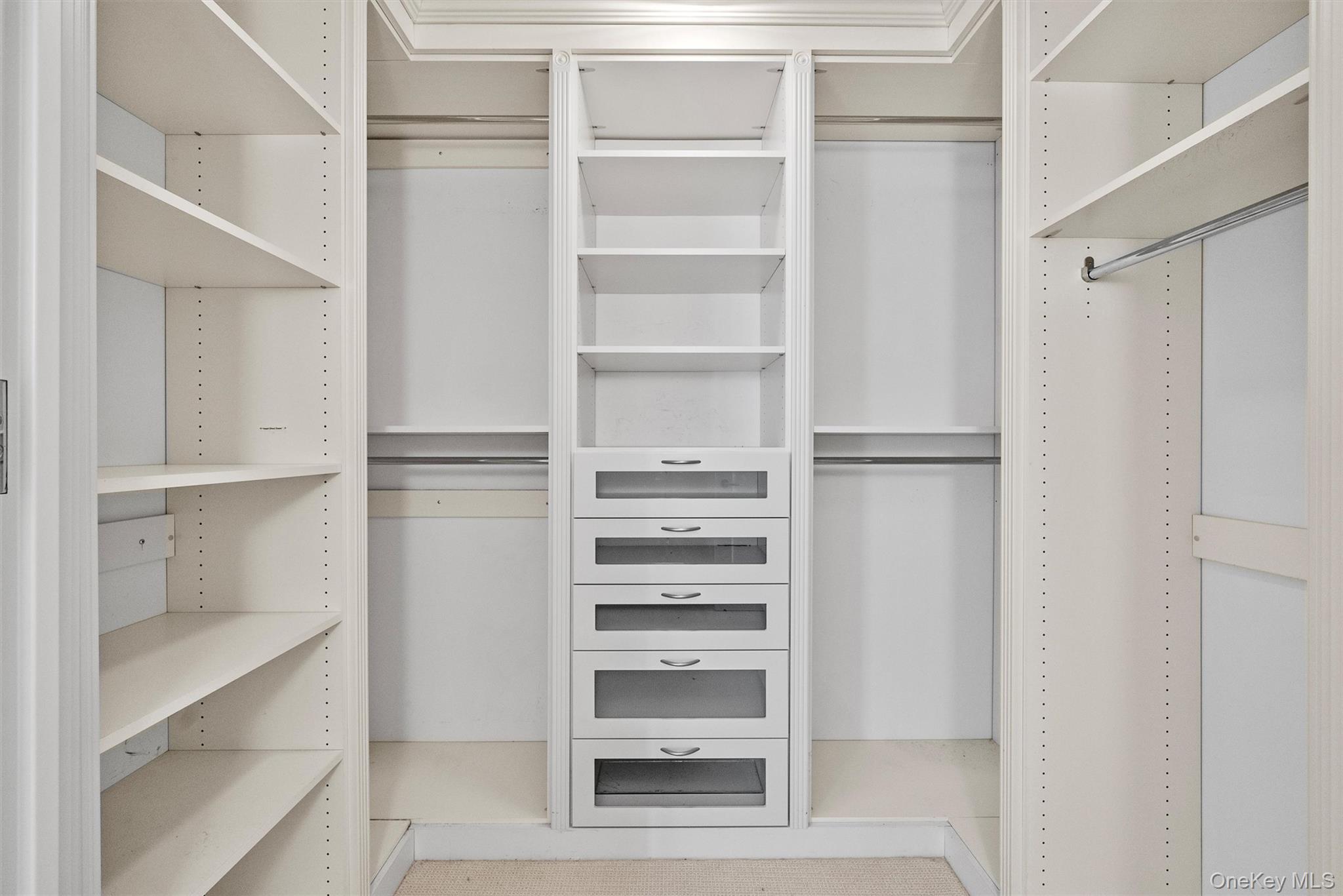 1 Renaissance Square, Unit 12E White Plains, NY 10601 - Photo 13 of 25 a view of walk in closet with empty racks