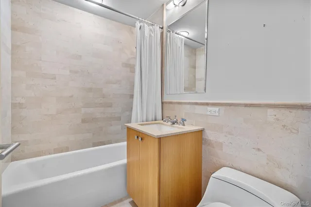 a bathroom with a sink toilet and bathtub