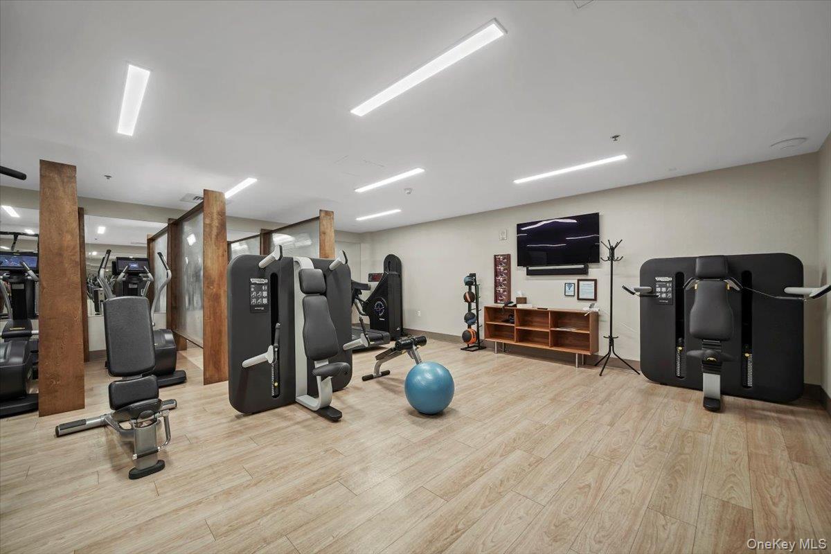 1 Renaissance Square, Unit 12E White Plains, NY 10601 - Photo 18 of 25 a view of a room with gym equipment