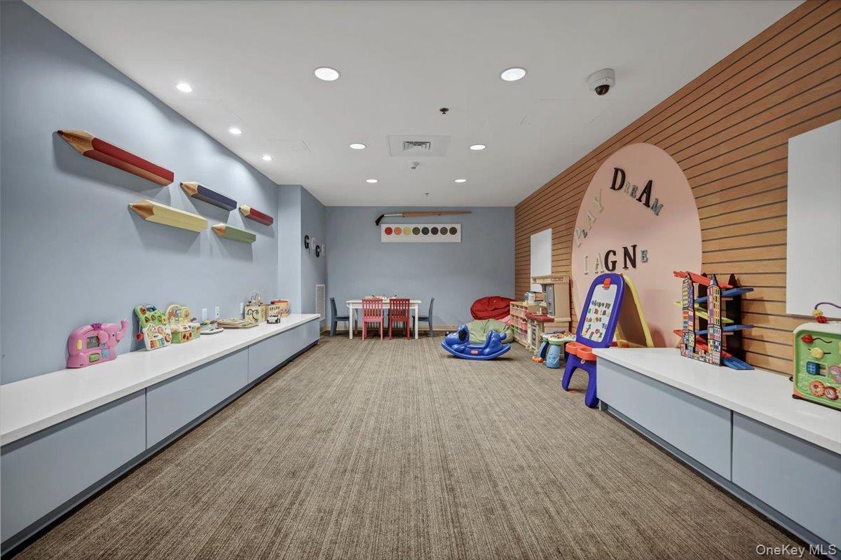 1 Renaissance Square, Unit 12E White Plains, NY 10601 - Photo 24 of 25 a very nice looking room with furniture and white walls