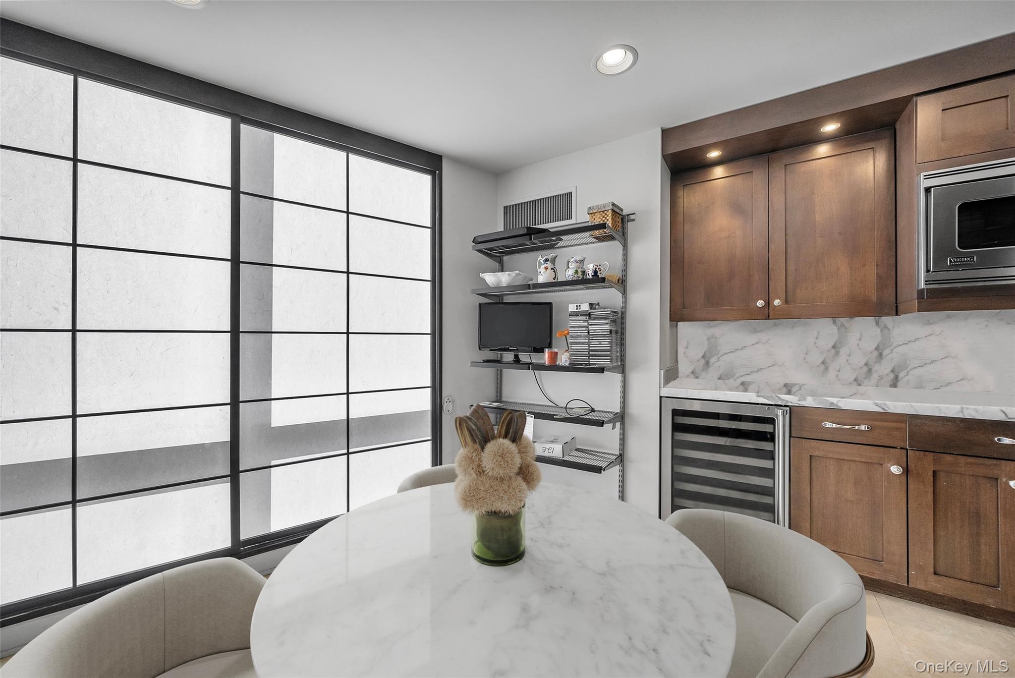 1 Renaissance Square, Unit 12E White Plains, NY 10601 - Photo 6 of 25 a kitchen with appliances cabinets and a sink