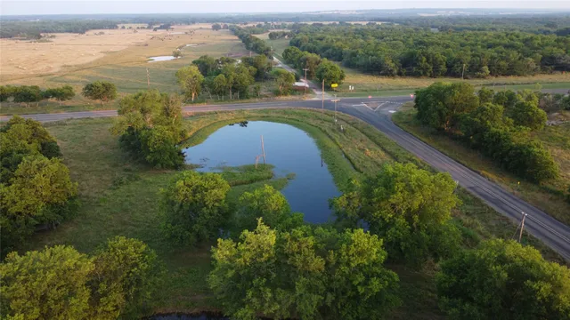 a view of a field with an ocean