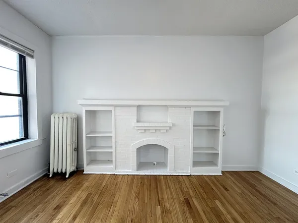 wooden floor fireplace and natural light