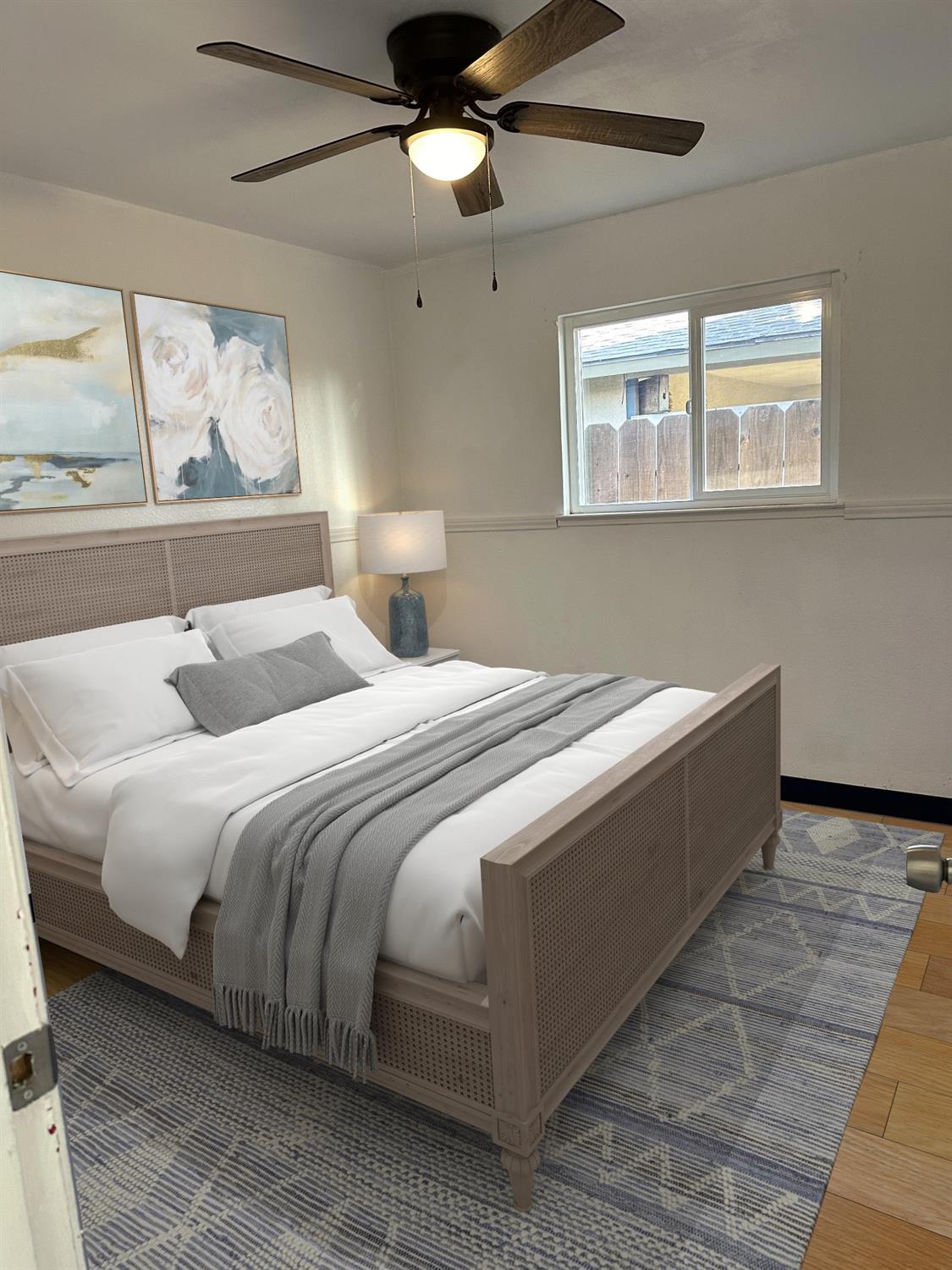 1319 Adler Drive Clovis, CA 93612 - Photo 11 of 20 a bedroom with a large bed and a window