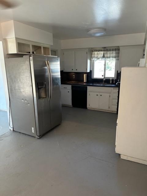 1319 Adler Drive Clovis, CA 93612 - Photo 17 of 20 a kitchen with refrigerator and white cabinets
