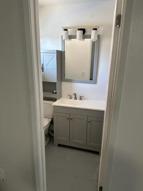 1319 Adler Drive Clovis, CA 93612 - Photo 19 of 20 a bathroom with a sink vanity and mirror