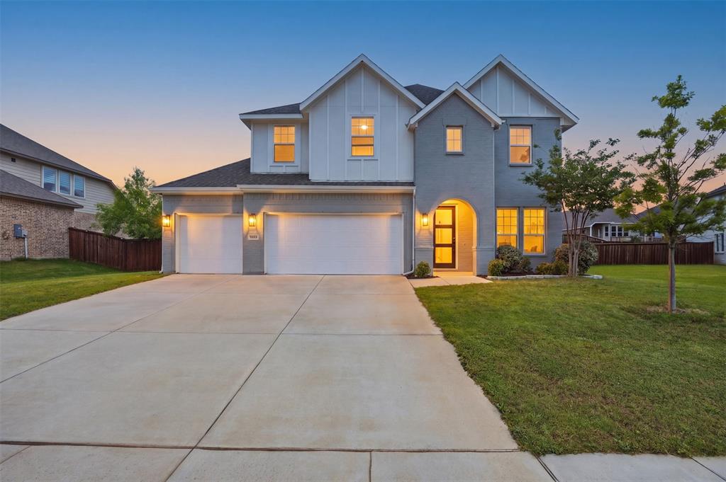 5805 Heatherwood Loop Sachse, TX 75048 - Photo 1 of 39 a front view of a house with a yard and garage