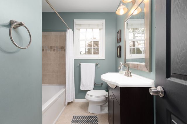 a bathroom with a sink a toilet and a bathtub