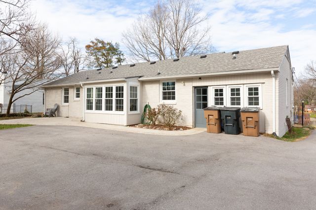 a view of a house with large outdoor space and balcony
