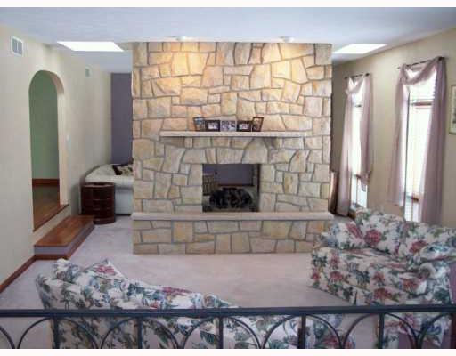 942 Mallisee Road Plum, PA 15239 - Photo 2 of 8 Living Room. Step down living room with 2 sided gas fireplace