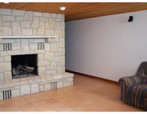 942 Mallisee Road Plum, PA 15239 - Photo 6 of 8 Den/Family/Great Room. Game room with gas fireplace, tile floor & hardwood ceiling