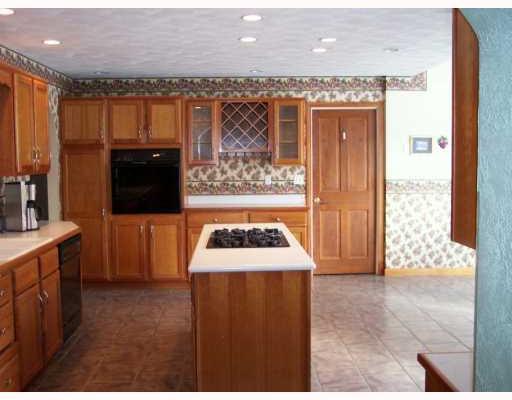 942 Mallisee Road Plum, PA 15239 - Photo 7 of 8 Kitchen. Kitchen with recessed lighting, tile floor & ample counter/cabinet space