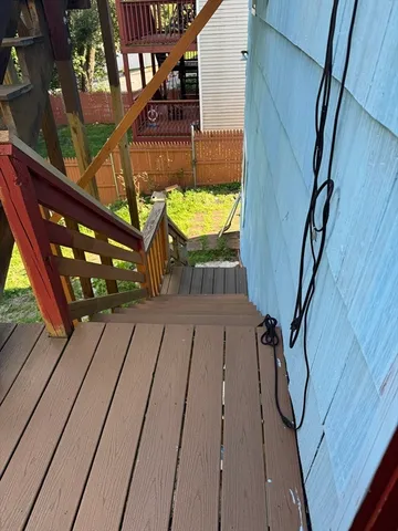 a terrace with outdoor seating and wooden floor