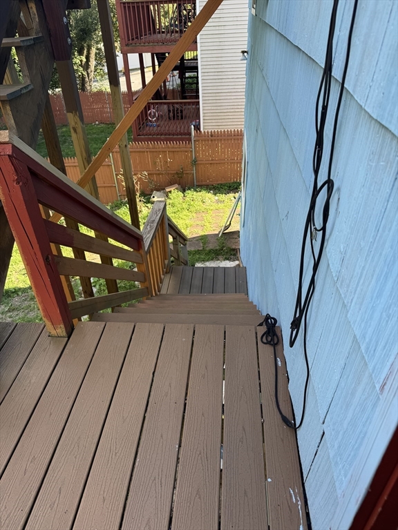 17 Thenius Street Worcester, MA 01607 - Photo 13 of 24 a terrace with outdoor seating and wooden floor