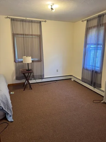 a view of room with air conditioner and window