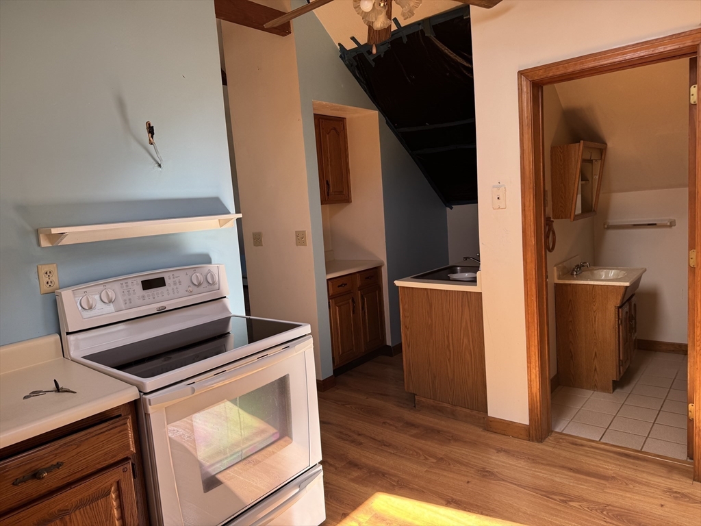 17 Thenius Street Worcester, MA 01607 - Photo 7 of 24 a view of kitchen and wooden floor