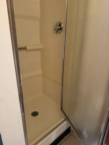 a bathroom with a glass door