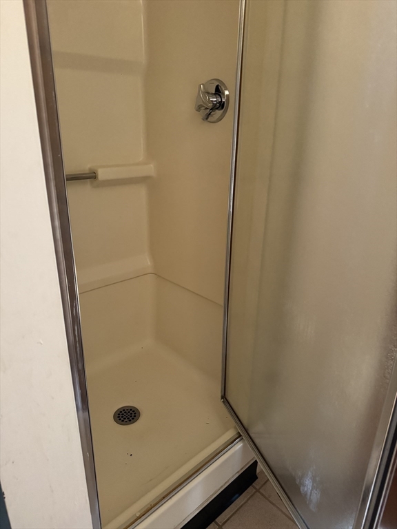 17 Thenius Street Worcester, MA 01607 - Photo 10 of 24 a bathroom with a glass door