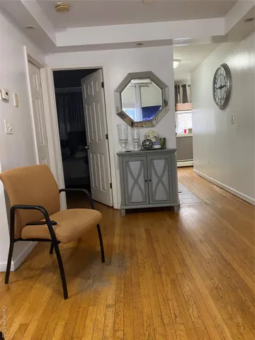 a view of a livingroom with furniture and wooden floor