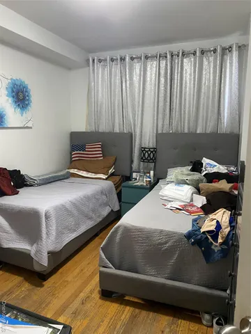 a bedroom with bed and a window