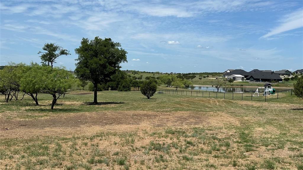 2048 Trace Ridge Drive Weatherford, TX 76087 - Photo 6 of 15 a view of a lake with a yard