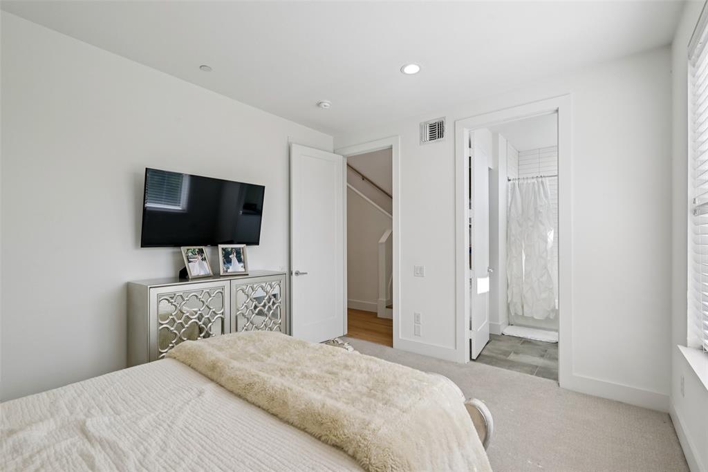 4511 Arberry Lane Dallas, TX 75219 - Photo 19 of 40 Another view of the secondary bedroom with private bath access.