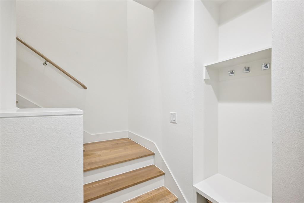 4511 Arberry Lane Dallas, TX 75219 - Photo 23 of 40 Built-in hooks and bench create a practical drop zone.